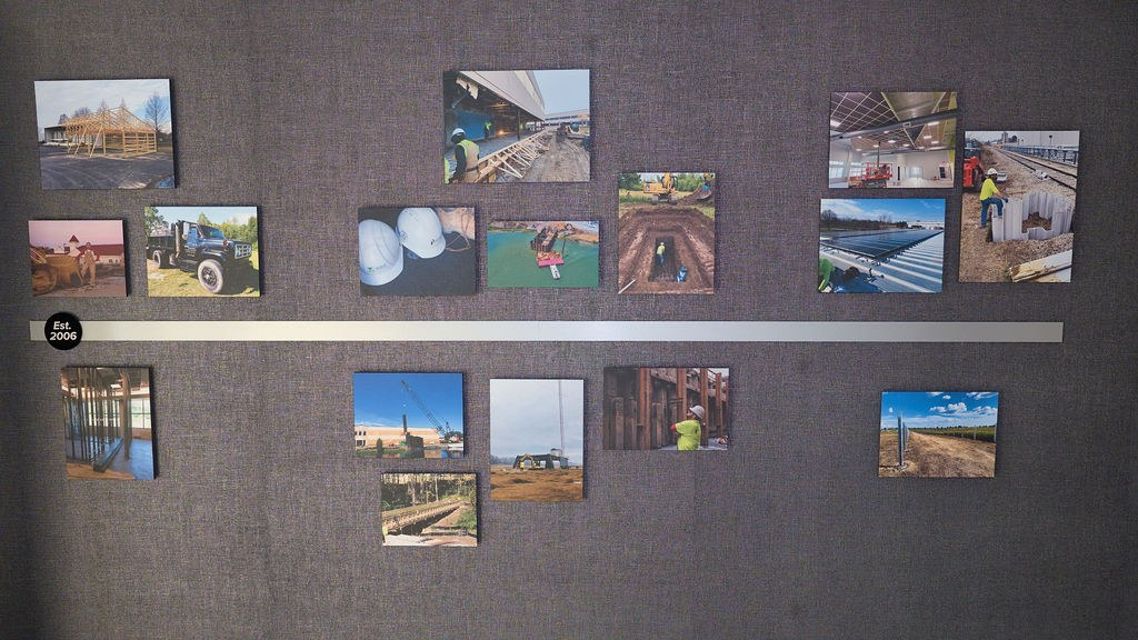 Timeline wall of McRae project photos marked Est. 2006