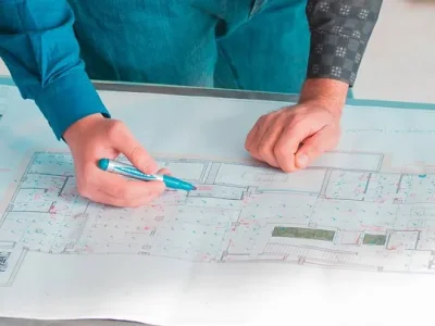 Architectural team reviewing floor plan